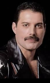 This is a photo of Jamal Zook “Samuel” Cooke (Freddie's nephew) in his home  with a picture of Freddie in the background. He said “Growing up it all  felt quite normal because