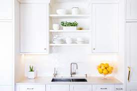 In most traditional kitchen layouts there is a shorter cabinet placed above the sink. 10 Beautiful Open Kitchen Shelving Ideas