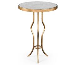 The table's round surface make it strikingly reflective while contributing to the luxe visual. Glass Side Table Round Swanky Interiors