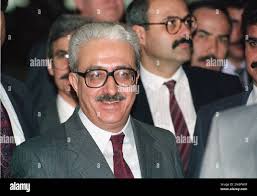 Iraqi Foreign Minister Tariq Aziz leaves the conference room after his  initial meeting with U.S. Secretary of State James A. Baker in Geneva,  Switzerland, Jan. 9, 1991. The meeting took place after