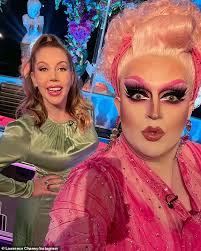 Pregnant Katherine Ryan shows off her blossoming baby bump in a black maxi  dress