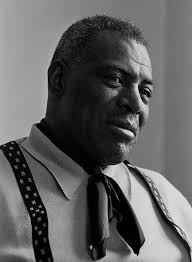Chester Burnett aka HOWLIN' WOLF had a bigger-than-life style all his own,  with a huge rough voice and his signature howl, half yodel, half  call-of-the-wild. He grew up in Mississippi and Arkansas