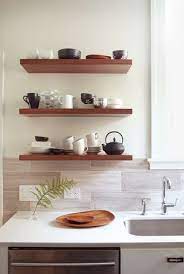 Floating Shelves See How Easily They Create Open Airy Interiors Designed Floating Shelves Kitchen Contemporary Kitchen Floating Shelves