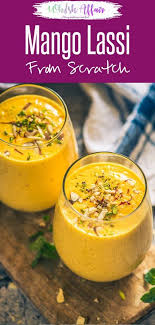 Nicely Frothed With Fresh Dollops Of Yogurt Ripe Mango Sugar Cardamom Powder And Heaps Of Ice Cube Lassi Recipes Mango Lassi Recipes Best Mango Lassi Recipe