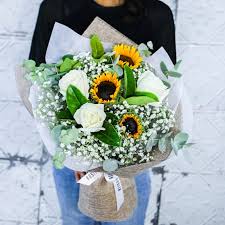 Bouquet measures 13h by 10l. The Graduation Bouquet Sunflowers And Roses