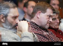 From left, Thomas McLeod of Montpelier, Vt., Jim Ross of Barre, Vt., and  Lynda Dowling of Montpelier, listen to employee's personal accounts of  outsourcing of Vermont jobs, Monday, March 29, 2004, in