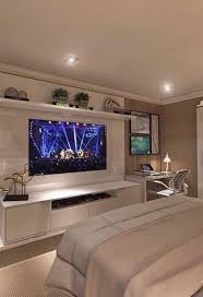 This bedroom has a very country look to it, especially with that wrought iron bed. Bedroom Design Ideas With Tv Trendecors