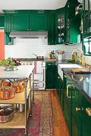 Its rich profile elevates the rustic wood details in the space, plus it makes the vintage oil paintings that lean against the wall pop. Emerald Green Kitchen Walls Novocom Top