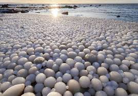 Thousands of bizarre 'ice eggs' cover beach in Finland in rare phenomenon |  The US Sun
