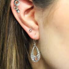 A pair of white chairs. Stephanie Maslow Blackman Curated Ear Stacking Or Layering Earrings You Ve Heard All About Layering Necklaces And Stacking Rings But Have You Heard Of Curated Ears No Then Let S Have An Earring Party A Curated