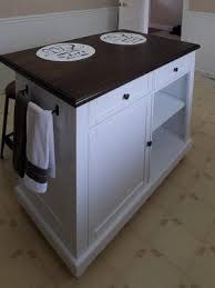 The slotted shelves and spindle legs of this kitchen island are reminiscent of french quarter architecture. Dorel Living Kelsey Kitchen Island With 2 Stools And Drawers White Walmart Com Walmart Com