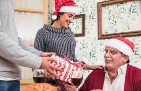 Yes, every year, you can go online or go to a big box store and find some expert who will tell you what's if your man is rabid about some team (college or pro), get tickets to whatever you think he would love. Free Photo Man Giving Gift Box To Old Man In Santa Hat