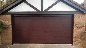 Exterior door types the front door: Double Alutech Sectional Garage Door In The L Ribbed Design With A Rosewood Effect Door Has An External Release Kit Complete With A Nrg Black Edition Motor And 2 X Remote Controls