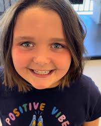 This little lady just got 10 inches cut off of her hair. She loves her new  look for school. When she saw herself in the mirror her eyes got really big  and