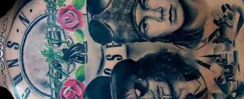 For the latest guns n' roses latest news check out our blog: 40 Guns And Roses Tattoo Designs For Men Hard Rock Band Ink Ideas