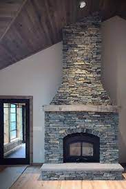 We are using leftover veneer stone for fireplace. Buechel Stone On Twitter Rustic Interior Stone Veneer Fireplace Surround In Dry Stacked Stone Barnwood Blue Ledgestone Stoneveneer Stonefireplace Stackedstone Ledgestone Rustic Stonehearth Naturalstone Stoneveneerfireplace