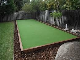 While building a bocce ball court takes a lot of work, it's easy to do with some planning and a little help. Fremont Project Type Bocce Ball Courts Materials 4x6 Wood Boarder Olive Green Turf Texturized Poly Bocce Ball Court Backyard Putting Green Green Backyard