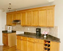 You could even duplicate that trim along the top edge of the cabinet doors as well and put flat stock above that. Adding Kitchen Cabinet Moulding To Existing Cupboards