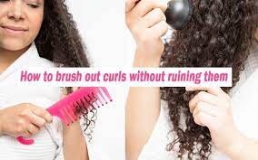 Using a wide tooth comb or denman brush How To Brush Out Curls Without Ruining Them Step By Step Guide