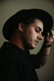 Man wearing black fedora hat photo