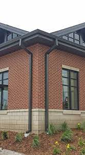 Black soffit and fascia red brick. Tri County Does It All Gutters And Downspouts Roofing Siding Soffit And Facia Comfort Zone Brick Exterior House Red Brick House Exterior Red Brick House