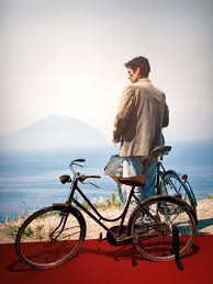 A simple italian postman learns to love poetry while delivering mail to a famous poet, and then uses this to woo local beauty beatrice. Massimo Troisi Il Postino Latitudes