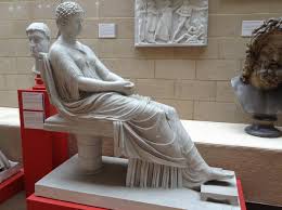 Standing straight, the right leg slightly forward, the left arm bent at the elbow, perhaps. Seated Roman Woman Romans In Focus