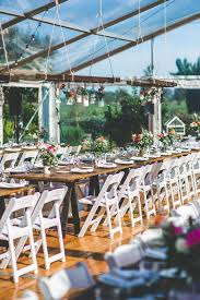 White Padded Folding Chair Vintage Timber Trestle Table Hanging Paling Feactuers Clear Ma White Folding Chairs White Chairs Wedding Wedding Tent Decorations