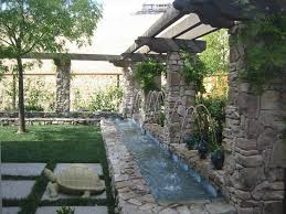 The way the water falls on rocks and the beautiful sound it makes could keep you but you can make your own waterfall and the advantage for that is that you get to place it wherever you want and to design it how you want. Idea Waterfall Backyard Pond
