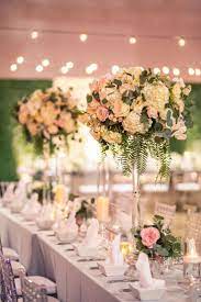 Floral Centerpieces Decor This Couple Had A Stunning Wedding At The Garage Burbank The Flo Wedding Table Centerpieces Wedding Reception Design Wedding Table