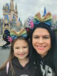 The iconic Mouse Ears tied up with a cute bow 🎀 ! It's hard not to feel  that contagious happiness when you're wearing a pair of Mouse Ears while  walking down Main