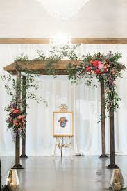 Natural Wood Chuppah With Bright Floral Arrangements Chuppah Decor Chuppah Chuppah Flowers