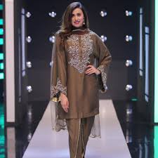 You can see now he wear coth according to fashion. New Pictures Of Couple Madiha Naqvi And Faisal Sabzwari Reviewit Pk