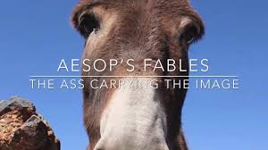 The camel, envious of the praises bestowed on the monkey and desiring to divert to himself the favor of the guests, proposed to stand up in his turn and dance for their amusement. The Ass Carrying The Image Fables Of Aesop