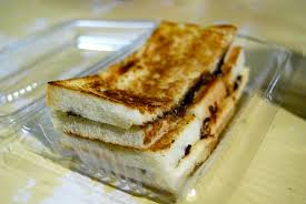 Two slices of bread are placed on top of each other, cemented together with a layer of creamy coconut jam (kaya) and margarine or butter. Roti Bakar 12 30 Am Diany Flickr