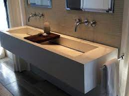 Miseno 60 free standing vanity set with cabinet, granite vanity top, two drop in sinks and widespread faucet holes. Two Faucet Sink Bmo Show