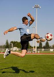 Soccer Kick Athletic Male In The Air Kicking A Soccer Ball Affiliate Athletic Male Soccer Action Pose Reference Fighting Poses Pose Reference Photo