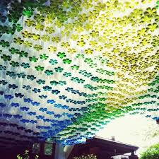 Recycled Plastic Bottles Partially Filled With Colored Water Used To Create A Parking Canopy Recycle Plastic Bottles Plastic Bottle Art Diy Plastic Bottle