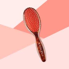 The brush not only detangles and helps curls clump, but the pad in the middle removes for making cleaning a breeze. Best Hairbrushes For Thick Hair Raincry Large Detangling Paddle Hairbrush Instyle