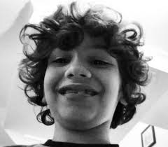 Your curl type is determined by the shape of the follicle that your hair grows out of from your scalp. A Photograph Of A Puerto Rican Boy Sporting His Long Wavy Hair In A Hairstyle Similar To The One Of Jim Morrison Long Hair Guys