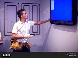 What should i do if my led tv has no picture? Man Worker Fix Tv Blue Image Photo Free Trial Bigstock