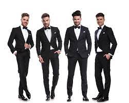 Foto De Elegante Grupo De Quatro Homens De Pe Com As Maos Nos Bolsos E Mais Fotos De Stock De Ficar De Pe Istock