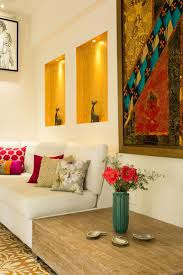 The living room is the space we use to recharge after a long day, the centre of the house, the space to spend time with your friends and family, and where we lie on the couch to binge watch a series or to read a good book. 8 Extraordinary Ways To Decorate The Wall Behind A Sofa