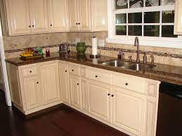 The stacked stone contains both brown and gray colors to unite the wood floors and gray cabinets. Blogger Brown Granite Countertops Antique White Kitchen Backsplash Kitchen White Cabinets