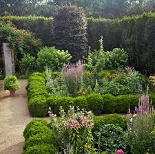 We did not find results for: Daisy Helman S Hidden Garden Might Just Be One Of The Prettiest We Ve Seen Hidden Garden Boxwood Landscaping Garden Design