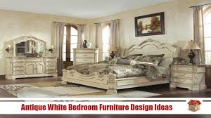 A pretty coastal farmhouse bedroom with a paneled wall, an upholstered bed, a wooden bench, a chic chandelier and a a fux rug. White Furniture Design Ideas Novocom Top