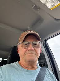 Old hippie picking up grandkids