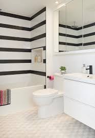 Maybe you would like to learn more about one of these? Ali Budd Interiors Contemporary Black And White Bathroom Boasts White And Black Striped Shower Bathroom Wall Tile Design Bathroom Tile Designs Big Bathrooms
