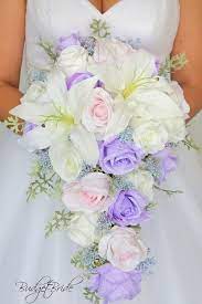 As for deep purple specifically, it combines very easily and beautifully with many different colors that can soften it (like shades of pink, green, etc.) or add even more glamour (like silver, black, gold, etc.). Iris Lavender Davids Bridal Wedding Bouquet Cascading Lily Brides Roses Blush Pink Ligh Cascading Wedding Bouquets Purple Bridal Bouquet Flower Bouquet Wedding