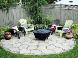 Corner Patio Adirondack Chairs And Fire Pit Don T Love The Circle Shape Of It Though Small Backyard Landscaping Backyard Fire Backyard